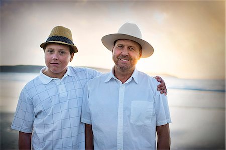 simsearch:6128-08737935,k - Portrait of a teenage boy standing with his arm around his father. Stock Photo - Premium Royalty-Free, Code: 6128-08738242