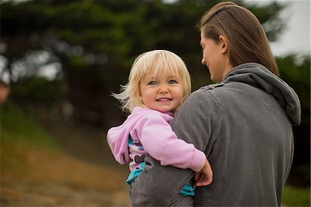 simsearch:6128-08728378,k - Young girl being carried by her mother. Foto de stock - Sin royalties Premium, Código: 6128-08738211