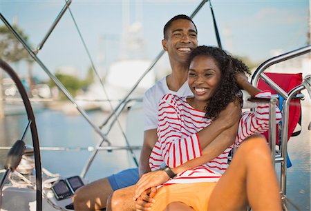 simsearch:6128-08737749,k - Young couple relaxing and having fun while sailing. Foto de stock - Sin royalties Premium, Código: 6128-08738484