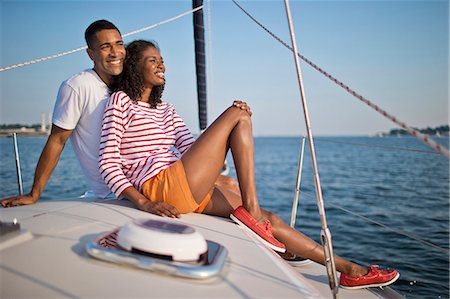 simsearch:6128-08737749,k - Happy young couple relaxing and having fun while sailing. Foto de stock - Sin royalties Premium, Código: 6128-08738501