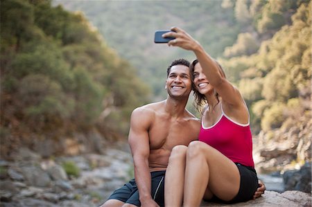 simsearch:6128-08738364,k - Smiling young couple posing for a self portrait. Stock Photo - Premium Royalty-Free, Code: 6128-08738535
