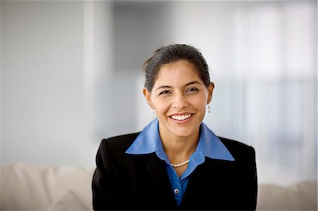 simsearch:640-02951608,k - Portrait of a smiling mid-adult businesswoman. Stock Photo - Premium Royalty-Free, Code: 6128-08840943