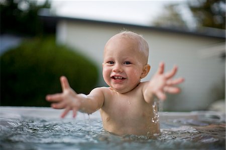 Baby boy playing in swimming pool Stock Photo - Premium Royalty-Free, Code: 6128-08840930