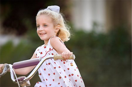 funny bikers pictures - Young girl riding a bicycle. Stock Photo - Premium Royalty-Free, Code: 6128-08825427