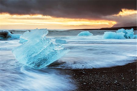 simsearch:879-09032981,k - Jokulsarlon, eastern Iceland, Europe. Blocks of ice on the black beach in Jokulsarlon Glacier Lagoon during a sunset Stock Photo - Premium Royalty-Free, Code: 6129-09044023