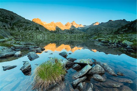 The rocky peaks are reflected in Lago Nero at dawn Cornisello Pinzolo Brenta Dolomites Trentino Alto Adige Italy Europe Photographie de stock - Premium Libres de Droits, Code: 6129-09044869