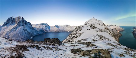 Panoramic view of the icy sea along the Mefjorden to Ornfjorden towards the peak of Mount Barden Senja Tromso Norway Europe Photographie de stock - Premium Libres de Droits, Code: 6129-09044916