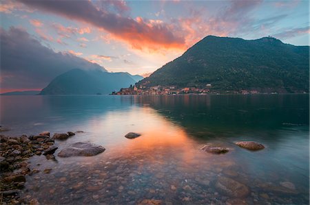 The lake shore and Peschiera Maraglio at sunset, Montisola, Iseo lake, Brescia province, Lombardy district, Italy Photographie de stock - Premium Libres de Droits, Code: 6129-09057552