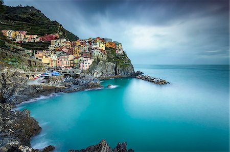 Long exposure of Manarola, Cinque Terre, Riviera di Levante, Liguria, Italy Stock Photo - Premium Royalty-Free, Code: 6129-09057753