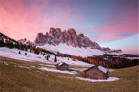 simsearch:6129-09057717,k - Sunrise with two wooden lodges and Odle Dolomites. Malga Gampen, Funes, Bolzano, Trentino Alto Adige - Sudtirol, Italy, Europe. Stock Photo - Premium Royalty-Free, Code: 6129-09057733