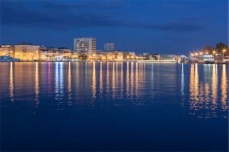 Europe, Croatia, Zadar. Skyscrapers and palaces at night close to the port area Stock Photo - Premium Royalty-Free, Code: 6129-09057942