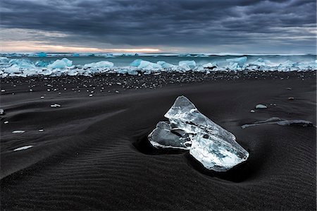 An ice floe on the Jokulsarlon black beach; Southern Iceland. Stock Photo - Premium Royalty-Free, Code: 6129-09057989