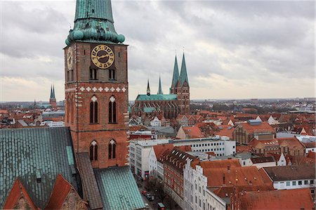 simsearch:6129-09044840,k - The gothic architecture of the medieval city and church with the typical bell tower Lübeck Schleswig Holstein Germany Europe Fotografie stock - Premium Royalty-Free, Codice: 6129-09058176