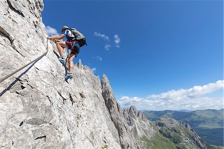 sexten dolomites - Climber on the via ferrata Roghel, Popera group, Sexten Dolomites, Comelico Superiore, Belluno, Veneto, Italy Photographie de stock - Premium Libres de Droits, Code: 6129-09086872