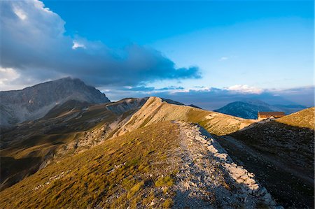 Italy, Abruzzo, Gran Sasso e Monti della Laga National Park, Duca degli Abruzzi mountain hut at sunset Stock Photo - Premium Royalty-Free, Code: 6129-09086814