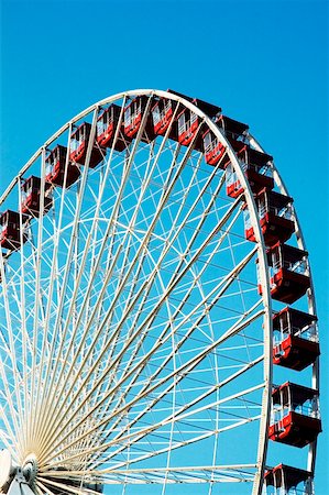 simsearch:625-00806318,k - Low angle view of a ferris wheel in an amusement park Stock Photo - Premium Royalty-Free, Code: 625-00804569
