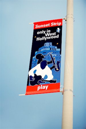 Low angle view of a Sunset Strip Flag On A Light Pole, Los Angeles California, USA Stock Photo - Premium Royalty-Free, Code: 625-00804756