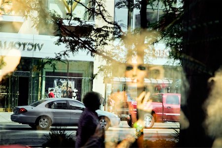 shops street usa - Reflection of the street on a store window, Magnificent Mile, Chicago, Illinois, USA Stock Photo - Premium Royalty-Free, Code: 625-00805306