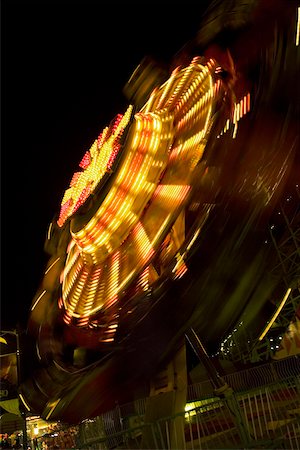 simsearch:625-00806318,k - Ride in an amusement park at night, San Diego, California, USA Fotografie stock - Premium Royalty-Free, Codice: 625-00805416