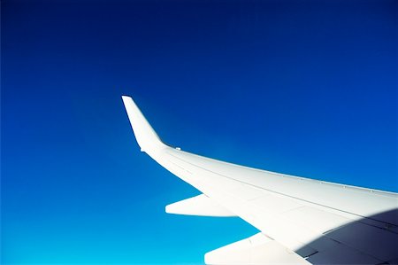 simsearch:625-00805855,k - Close-up of an airplane wing in flight Stock Photo - Premium Royalty-Free, Code: 625-00805556