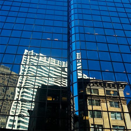 Low angle view of the reflection of buildings on a glass front, Boston, Massachusetts, USA Stock Photo - Premium Royalty-Free, Code: 625-00805923