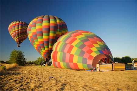 Hot air balloons preparing to take off Stock Photo - Premium Royalty-Free, Code: 625-00805994