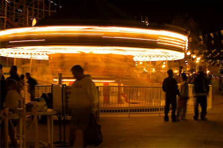 simsearch:625-00806318,k - Carousel in an amusement park at night, San Diego, California, USA Fotografie stock - Premium Royalty-Free, Codice: 625-00806143