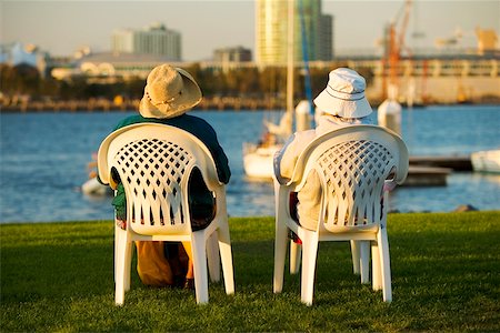 simsearch:625-00802074,k - Rear view of two people sitting on a waterfront, San Diego Bay, San Diego, California, USA Foto de stock - Sin royalties Premium, Código: 625-00806341