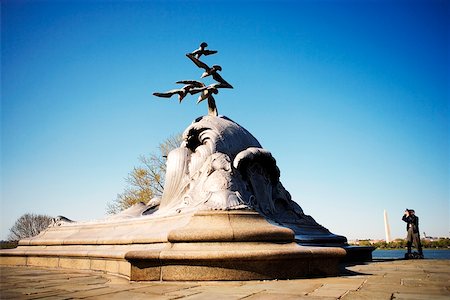 Tourist taking a photograph of a sculpture, Navy and Marine Memorial, Virginia, USA Stock Photo - Premium Royalty-Free, Code: 625-00806621