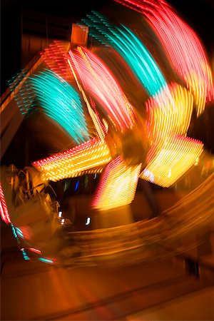simsearch:625-00806318,k - Lights glowing on a carnival ride at night, California, USA Stock Photo - Premium Royalty-Free, Code: 625-00801423