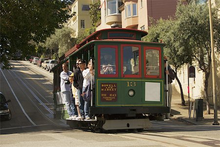 san francisco city streets - Low angle view of group of people in a cable car, San Francisco, California, USA Stock Photo - Premium Royalty-Free, Code: 625-00801550
