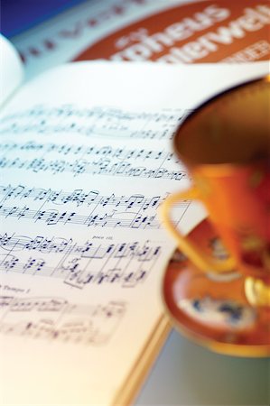 Tea or coffee cup, saucer and sheet music, close-up Stock Photo - Premium Royalty-Free, Code: 625-00801835