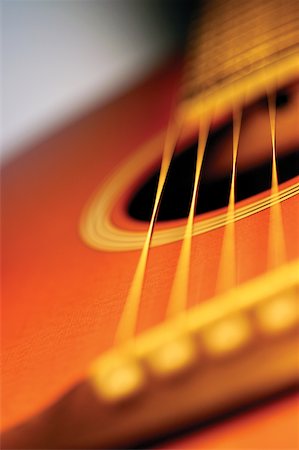 Close-up of guitar bridge and strings Stock Photo - Premium Royalty-Free, Code: 625-00801924