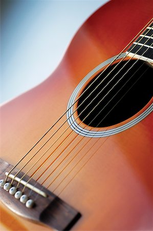 Close-up of guitar, its strings and frets Stock Photo - Premium Royalty-Free, Code: 625-00801968