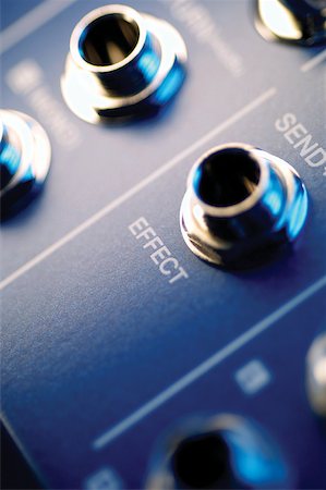 Holes for cables on sound mixer, extreme close-up Stock Photo - Premium Royalty-Free, Code: 625-00801960