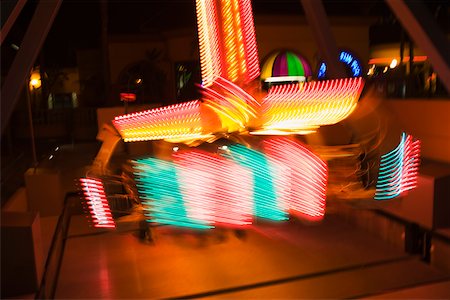 simsearch:625-00806318,k - Lights glowing on a carnival ride at night, California, USA Stock Photo - Premium Royalty-Free, Code: 625-00802035