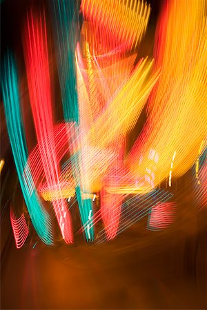 simsearch:625-00806318,k - Lights glowing on a carnival ride at night, California, USA Fotografie stock - Premium Royalty-Free, Codice: 625-00802037