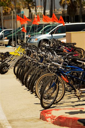 simsearch:625-00802108,k - Side profile of cycles parked on a sidewalk Stock Photo - Premium Royalty-Free, Code: 625-00802165