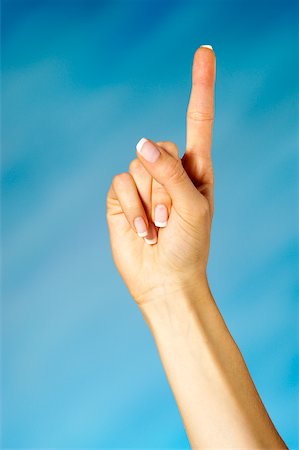 Close-up of a woman holding up one finger Foto de stock - Sin royalties Premium, Código: 625-00802482