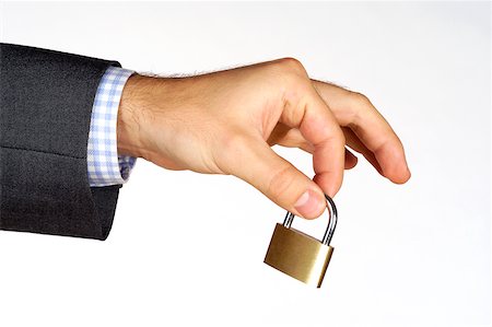 simsearch:625-00802665,k - Close-up of a person's hand holding a padlock Foto de stock - Sin royalties Premium, Código: 625-00802614