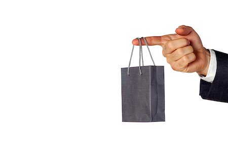 Close-up of a businessman holding a shopping bag Stock Photo - Premium Royalty-Free, Code: 625-00802638