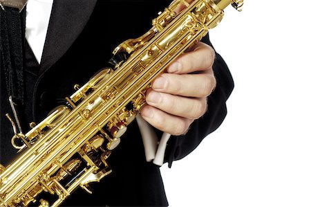 simsearch:625-00802645,k - Mid section view of a musician holding a saxophone Fotografie stock - Premium Royalty-Free, Codice: 625-00802683
