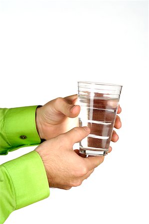Close-up of a man holding a glass of water Stock Photo - Premium Royalty-Free, Code: 625-00802694
