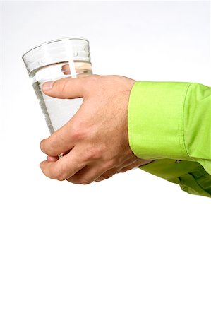 Close-up of a man's hands holding a glass of water Stock Photo - Premium Royalty-Free, Code: 625-00802735