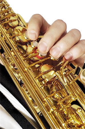 simsearch:625-00802645,k - Close-up of a musician's hand playing the saxophone Fotografie stock - Premium Royalty-Free, Codice: 625-00802784