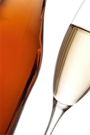 picture of champagne bottle and champagne flute - Close-up of a glass of wine with a wine bottle Stock Photo - Premium Royalty-Free, Code: 625-00802809