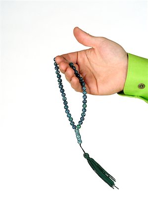 rosario - Close-up of a man's hand holding prayer beads Fotografie stock - Premium Royalty-Free, Codice: 625-00802829