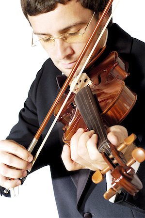Close-up of a musician playing the violin Stock Photo - Premium Royalty-Free, Code: 625-00802820