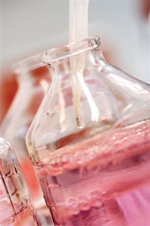 Close-up of a dropper in chemicals in a glass jar Stock Photo - Premium Royalty-Free, Code: 625-00836003