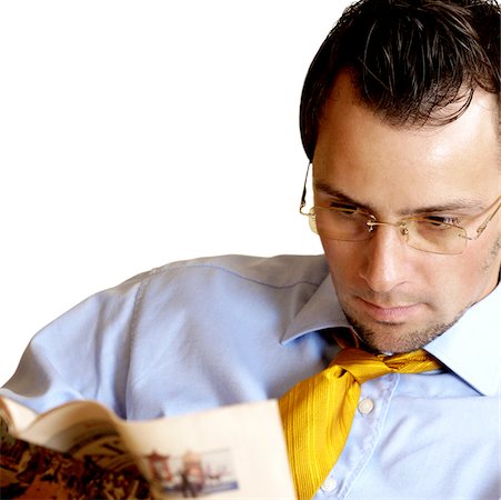 simsearch:640-01362317,k - Close-up of a businessman reading a newspaper Foto de stock - Sin royalties Premium, Código: 625-00836320